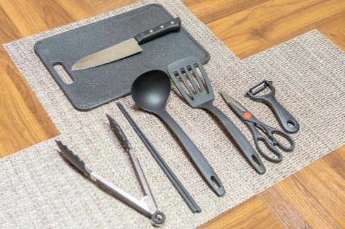 a bunch of utensils sitting on top of a table at Sanada Maru in Kaizuka