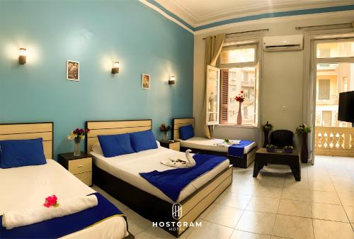 Postel nebo postele na pokoji v ubytování Hostgram Downtown Hotel & Suites