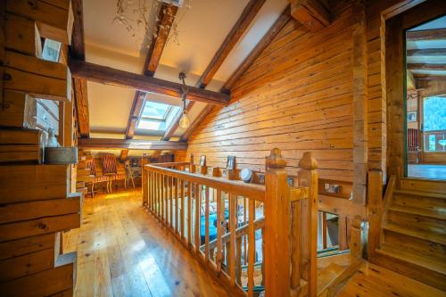 a wooden room with a staircase in a cabin at le vorger in Villard-sur-Doron
