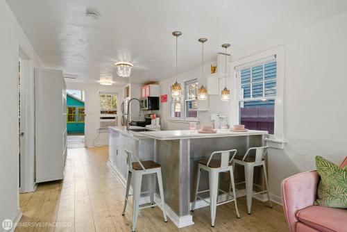 a kitchen with a large island in the middle of a room at The Love Shacks in Lake Worth