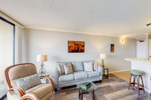 a living room with a couch and chairs at San Luis Getaway #435 by Vacasa in Galveston