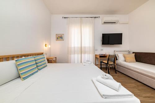 A bed or beds in a room at NG Guest House l'Acquedotto