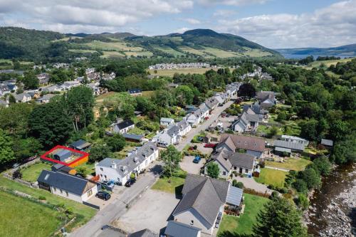 an aerial view of a small town with houses at Loch Ness Hideaway Pod in Lewiston