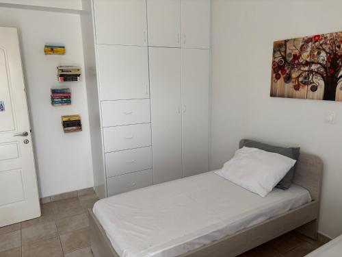 Ένα ή περισσότερα κρεβάτια σε δωμάτιο στο Elpida's comfortable house