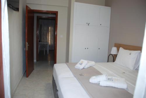 Ένα ή περισσότερα κρεβάτια σε δωμάτιο στο Gallery Rooms Ierissos