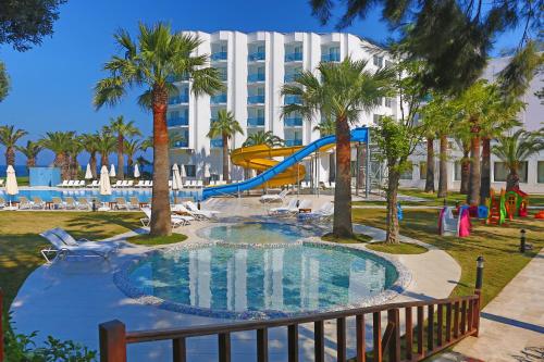 a pool with a slide in a resort at Le Bleu Hotel & Resort Kusadasi in Kusadası