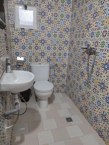 a bathroom with a toilet and a sink at Kaouki Beachside Apartment 3 peoples in Essaouira