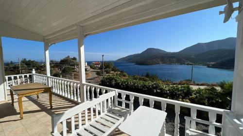 a porch with chairs and a view of the water at Villa Mira - 3BR Villa with Panaromic Sea View in Datca