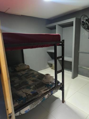Ένα ή περισσότερα κρεβάτια σε δωμάτιο στο Dulce Hogar Aparta Hotel