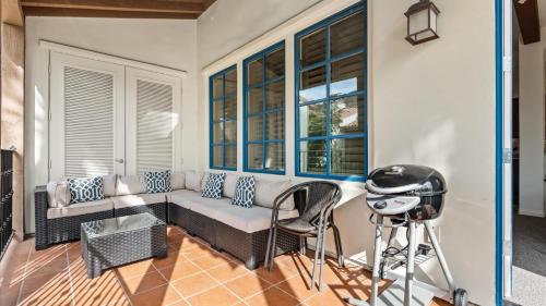 a living room with a couch and some windows at LV369 Stylish Upstairs 3BR 3BA LV Condo Near Pool in La Quinta