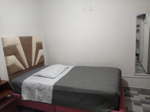 a bedroom with a bed in a room at Hotel Samana'Inn in Arequipa