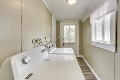 a white laundry room with two sinks and a window at Walk to Restaurants and Shops Dtwn Franklin Retreat in Franklin