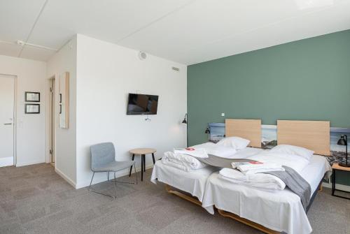 Postel nebo postele na pokoji v ubytování Hotel Nørherredhus