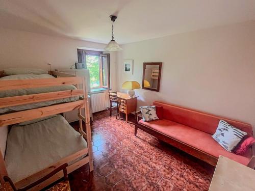 a living room with a couch and a bunk bed at Podere YogAyur in Parrano