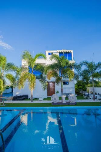 a view of a resort with a swimming pool at Kibada White Villa in Dar es Salaam