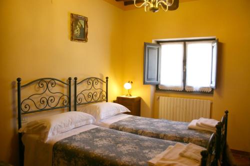 En eller flere senger på et rom på Villa Ca' Di Vestro