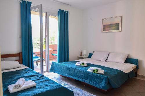 a bedroom with two beds with towels on them at Perfect Location close to Jaz beach - Apartments Rora Knezevic in Budva