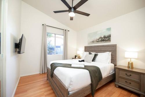 a bedroom with a bed and a ceiling fan at Stylish & Sunny With Heated Pool In The Foothills! in Phoenix