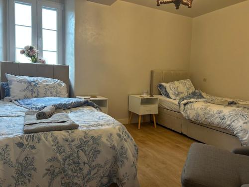 Ένα ή περισσότερα κρεβάτια σε δωμάτιο στο Maison de Champeaux