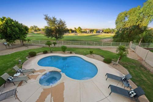 an overhead view of a swimming pool at a golf course at Golf Course Executive Home With Free Heated Pool! in Avondale