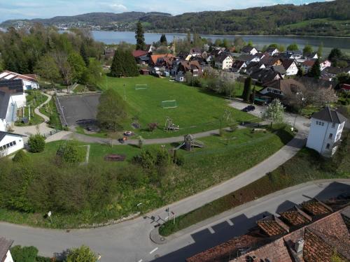 an aerial view of a small village with a park at Bodensee Penthouse 23i - Seesicht - Billiard - Panorama Exklusive in Öhningen