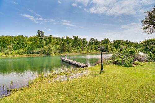 a dock in the middle of a lake at 3 Mi to Seneca Lake Couples Apt with River Access in Waterloo