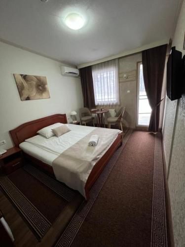 Postel nebo postele na pokoji v ubytování Hotel New Milenium