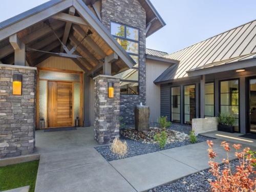 a house with a wooden door and a porch at Suncadia 5 Bdrm Home Wellness Retreat in Nelson Preserve in Cle Elum