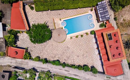 Πισίνα στο ή κοντά στο Escápate a una quinta con alberca, asador y diversión en familia