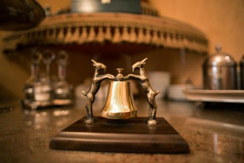 a small brass tea kettle on a counter at Rezydencja Solei Old Town in Poznań