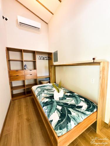 a bedroom with a bed in a room at Yiven Natural Village in Puerto Viejo
