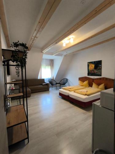 a large room with a bed and a couch at Rittergut Dröschkau in Dröschkau