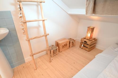 a room with a ladder and some boxes in it at Villa Mer - Large luxury family holiday home Ziltwater in Cadzand