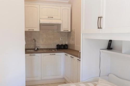 Η κουζίνα ή μικρή κουζίνα στο Guest House Navetta