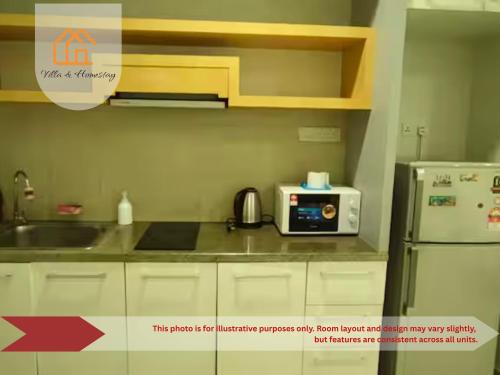 a kitchen with a refrigerator and a microwave at Cozy Studio unit,Cyberjaya,Wifi, Netflix,Free parking in Cyberjaya