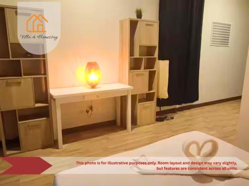 a room with a table with a light on it at Cozy Studio unit,Cyberjaya,Wifi, Netflix,Free parking in Cyberjaya