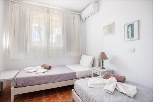 Ένα ή περισσότερα κρεβάτια σε δωμάτιο στο Acres Sunset Residence