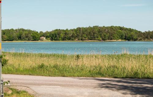 a road next to a large body of water at 3 Bedroom Beautiful Home In Nynäshamn in Nynäshamn