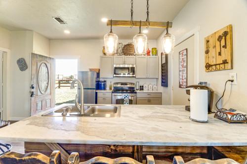 a kitchen with a sink and a counter top at 1 Mi to Lake Pet-Friendly Cabin in Strawn in Strawn