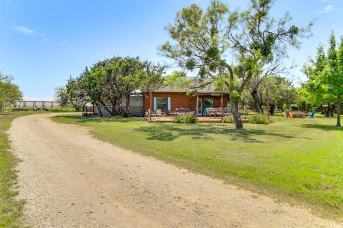 a dirt road in front of a house at 1 Mi to Lake Pet-Friendly Cabin in Strawn in Strawn