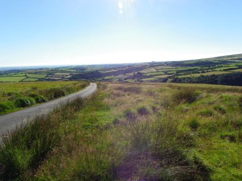 a winding road through the rolling hills at The Exmoor Caravan in Twitchen
