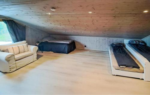 a room with two bunk beds and a couch at Beautiful Home In Dølemo in Austenå