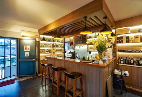 a bar in a restaurant with stools at Nha Khach Giao Thong in Hanoi