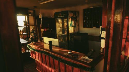 a bar in a pub with a christmas tree on the counter at Hotel Puerto Mayor in San Antonio