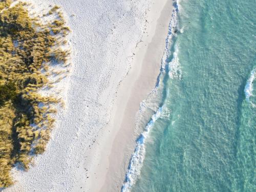 an overhead view of a beach and the ocean at High On Coffey - Binalong Bay - Pet Friendly in Binalong Bay