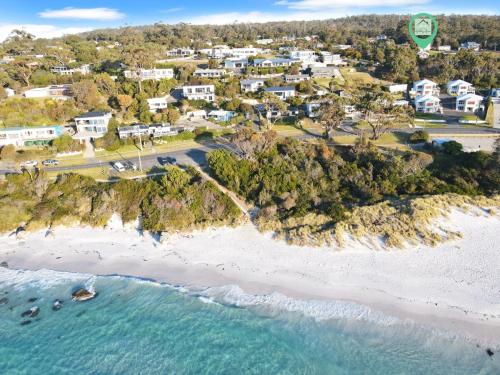 an aerial view of a beach with houses at High On Coffey - Binalong Bay - Pet Friendly in Binalong Bay