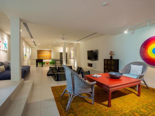 a living room with a table and chairs at Sava Ocean View Villas in Natai Beach