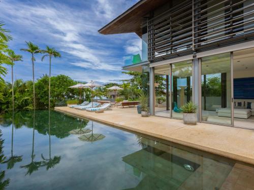 an exterior view of a house with a swimming pool at Sava Ocean View Villas in Natai Beach