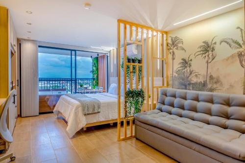 a living room with a bed and a couch at Edificio Habitare Cristales Cali 2 in Cali