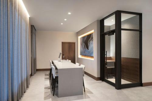 a bathroom with a sink and a mirror at AC Hotel by Marriott Old Montreal in Montréal